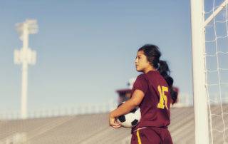 Portrait of a high school soccer player of Latin descent.