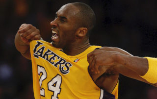 kobe bryant popping out his lakers jersey during a game