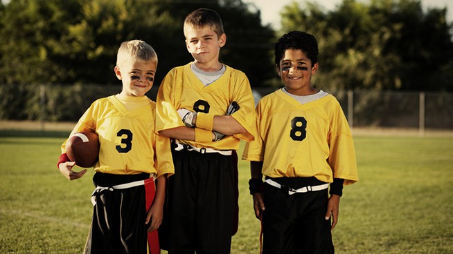 Members of a young male flag football team.