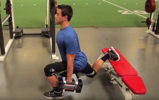 male performing single leg exercise at gym