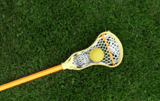 box lacrosse stick and ball