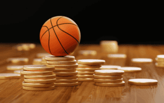 graphic image of basketball sitting on gold coin for nil deal article